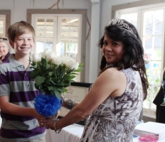 Stephanie Hoppmeyer receiving flowers from her son.